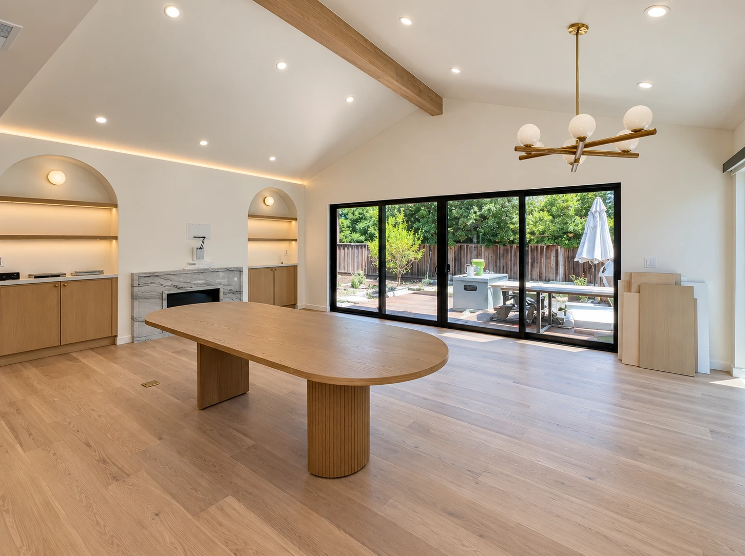 Click to view full screen Living room with dining table and yard access