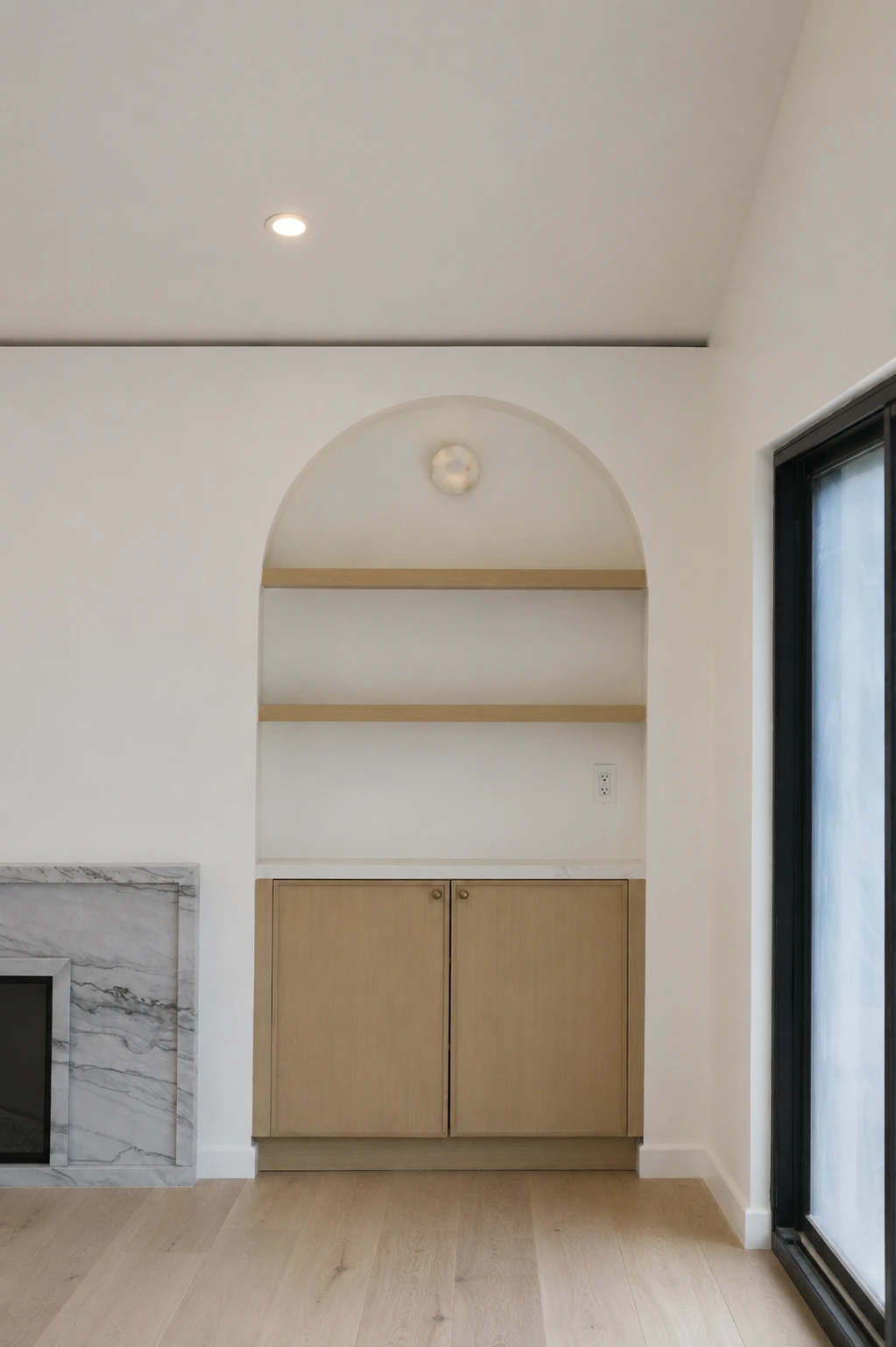 Click to view full screen Fireplace and arched display niche in the living room