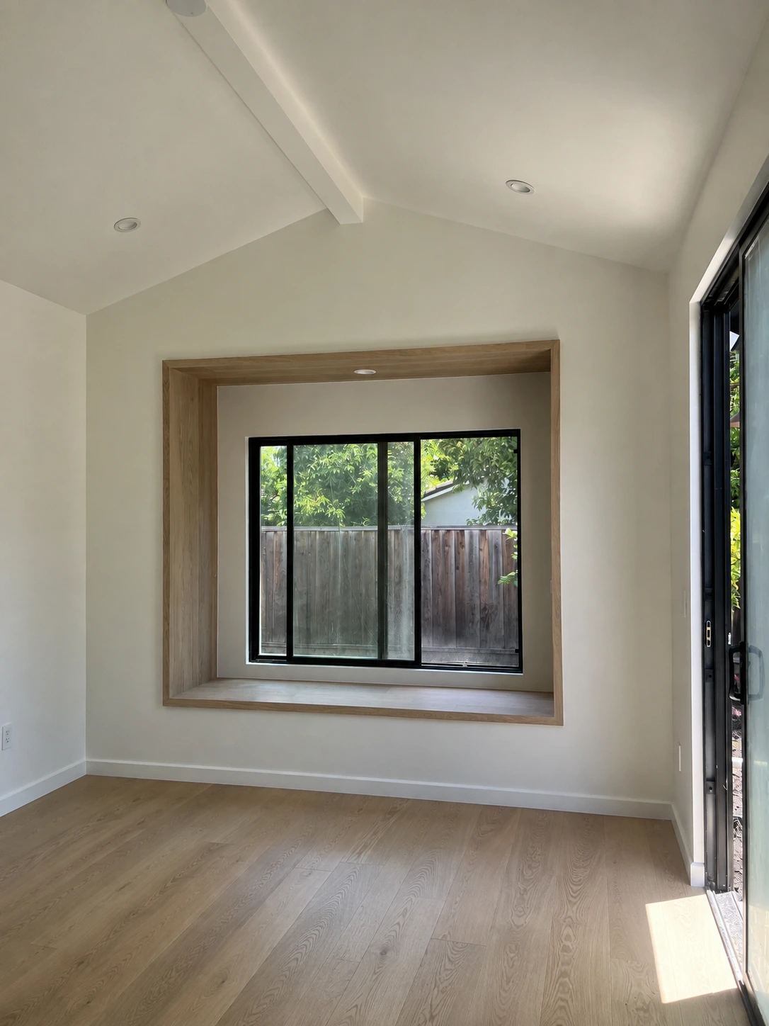Click to view full screen Bedroom with deep window seat and vaulted ceiling