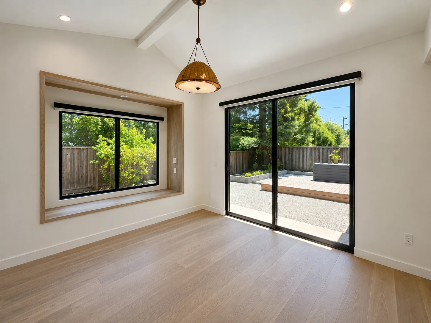 Click to view full screen Bedroom with window seat and sliding doors to the deck
