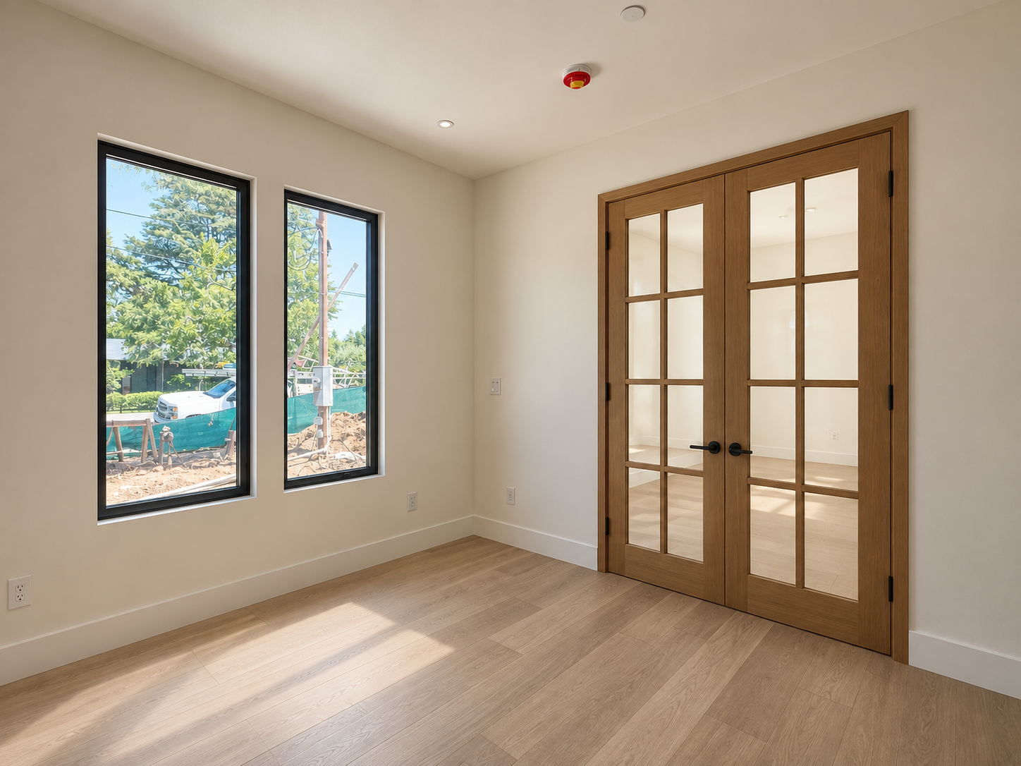 Click to view full screen Bedroom with paired glazed doors and white oak flooring