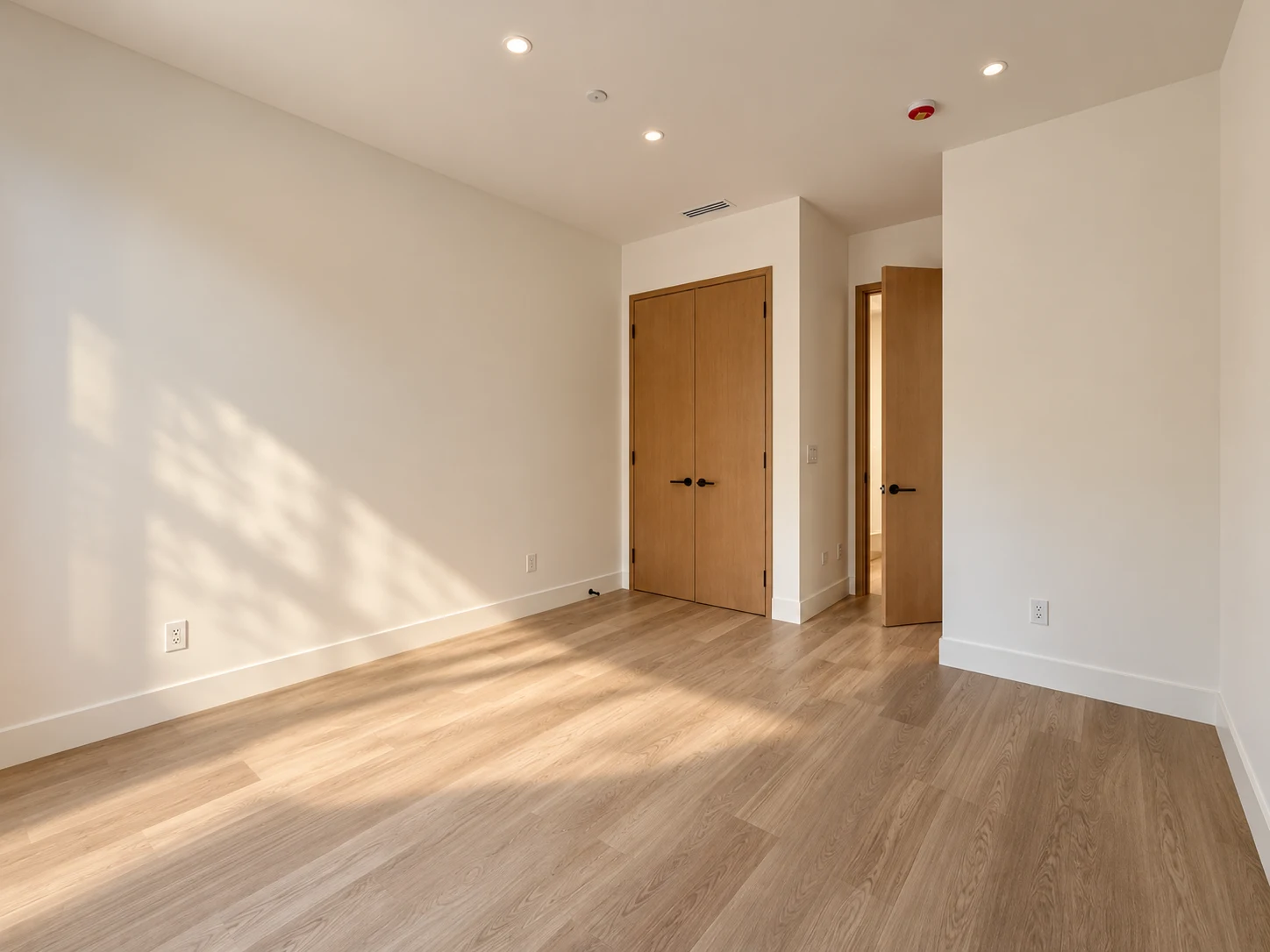 Click to view full screen Bedroom with closet doors and an ensuite entry
